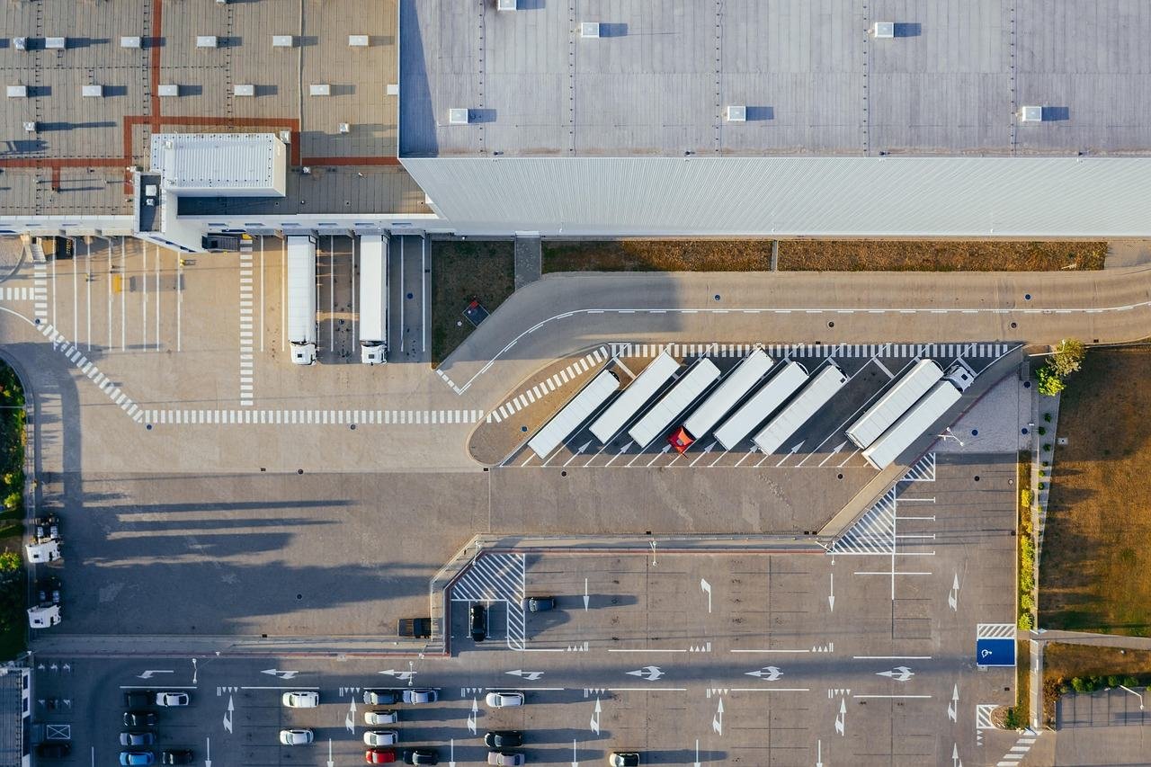 Aerial view of a distribution centre with trailers at the loading docks
